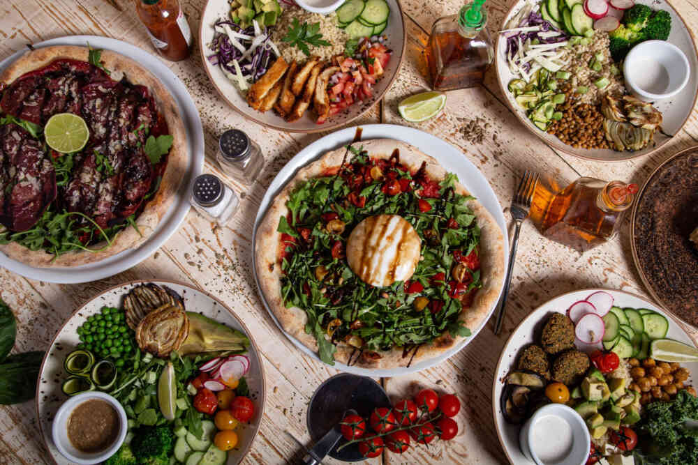 dinner-table-full-traditional-mexican-dishes-salads-1
